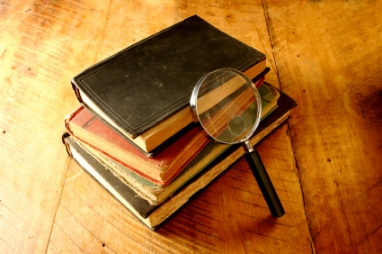 Old Books with Magnifying Glass